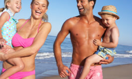 Family Having Fun On Beach