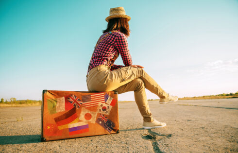 Suitcase with stamps flags