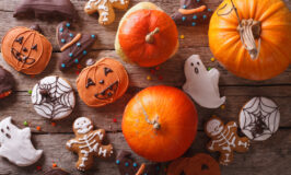 Beautiful gingerbread and fresh pumpkin on the table