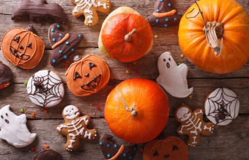 Beautiful gingerbread and fresh pumpkin on the table