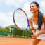 Woman playing tennis and waiting for the service